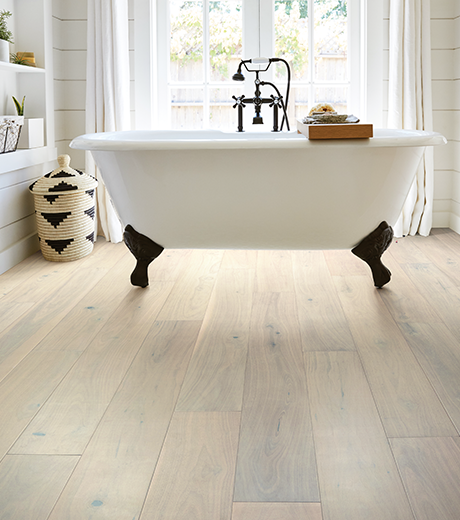 standalone tub on laminate flooring